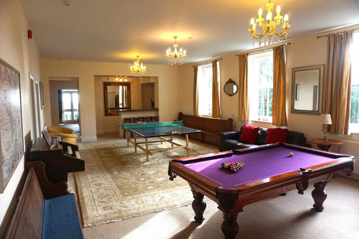 Big games room with bar, table tennis, pool table and spectator seating